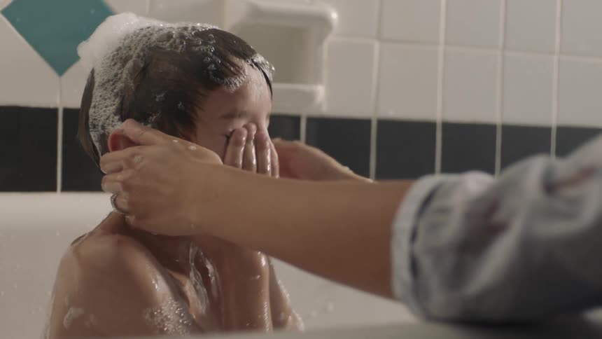 A child is getting a bath