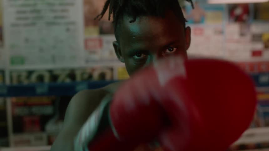 A boxer punches the air