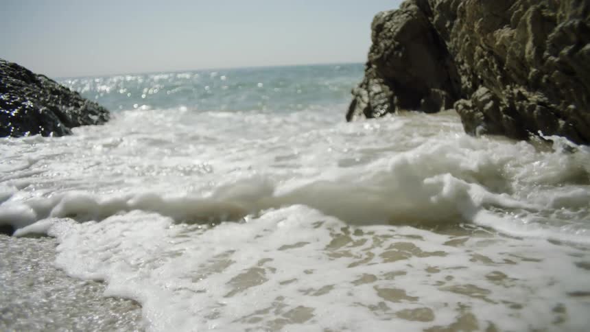Ocean waves are crashing towards the coast
