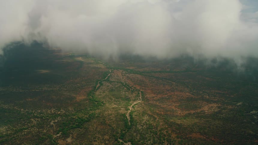 Clouds hang over the landscape