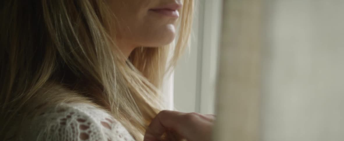 A woman plays with her hair