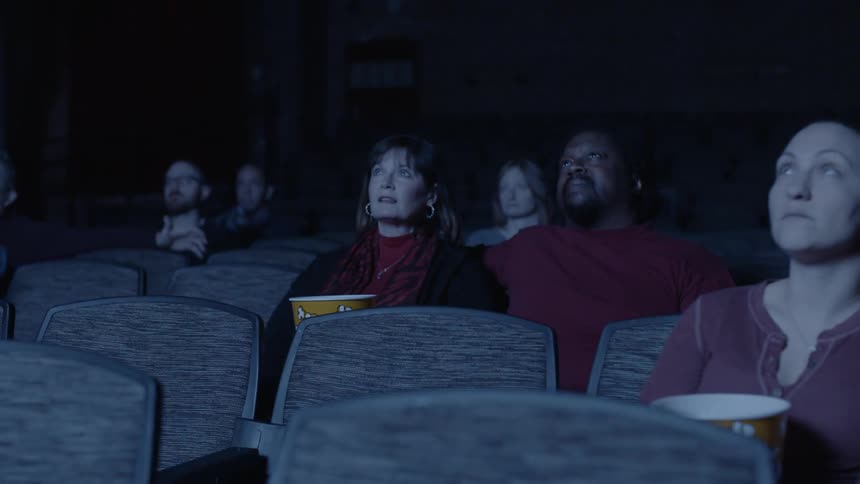 People watch a movie in a movie theater