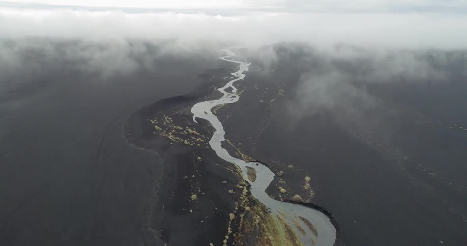 A river flows through a rural landscape