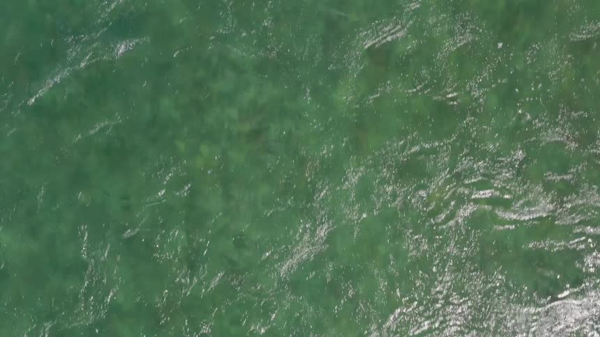 The water moves fast waves throughout the green water