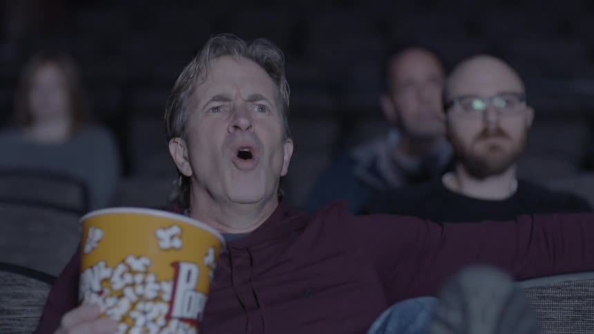 A man is yelling in the moving theater