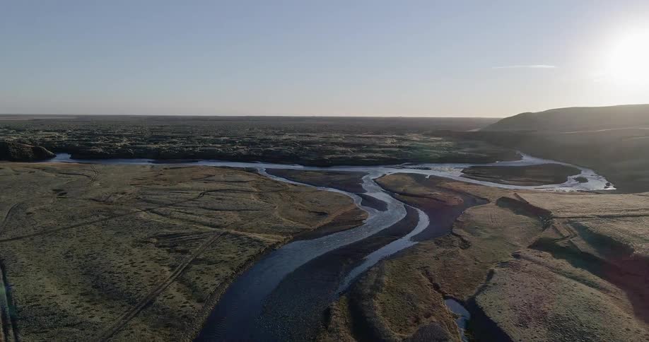 A small curvy river meets at a fork