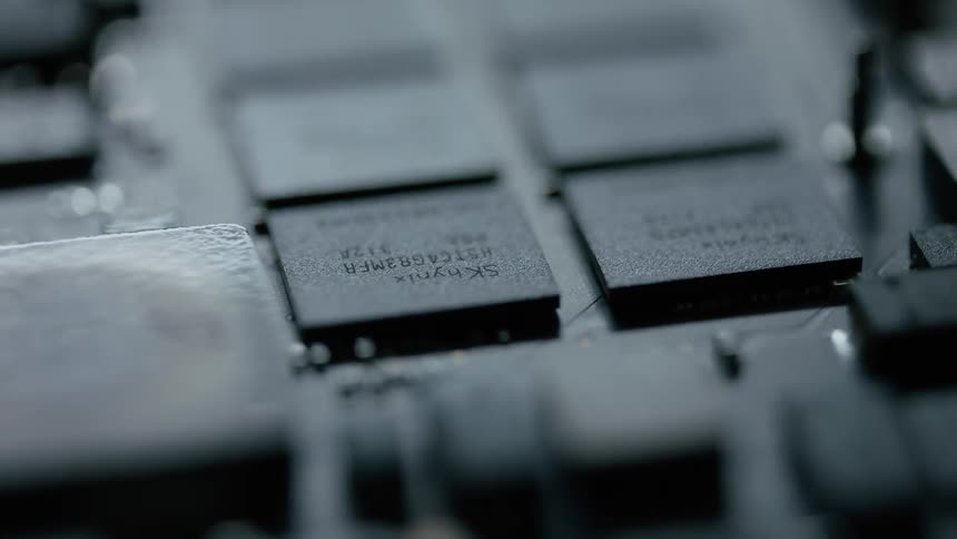 Electrical components and chips are illuminated by light then fade