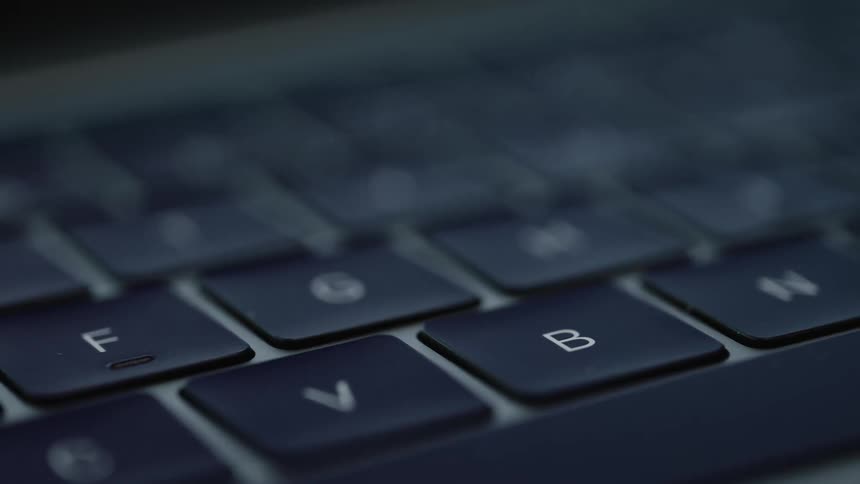 The keys are slightly lit in a dark room