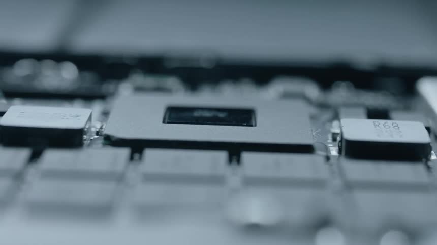 Light shines on exposed electrical components and chips