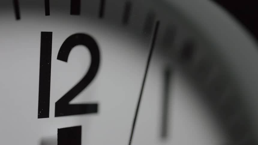 The clock slowly moves telling time