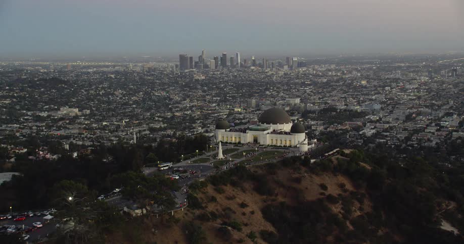 Flying over the Griffith Observatory with Downtown LA in the background