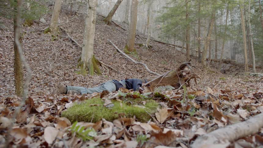 Soldier lays on the ground as if dead