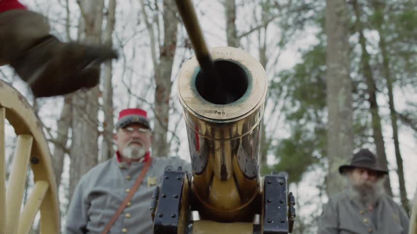 Soldiers load a cannon
