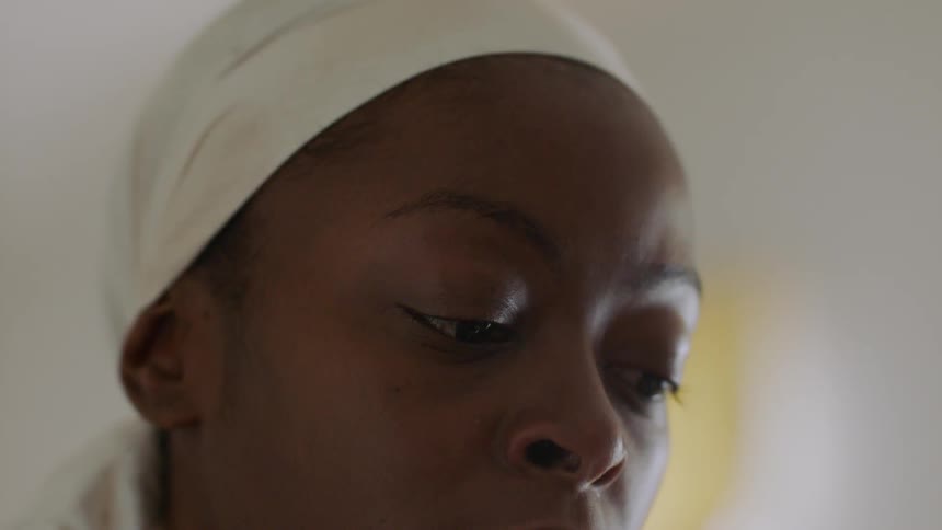 Woman's face as she is looking downward