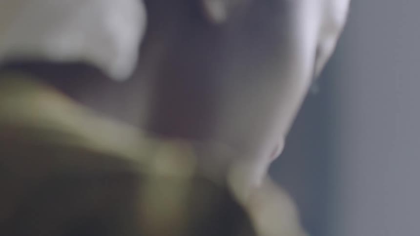Woman looks behind her
