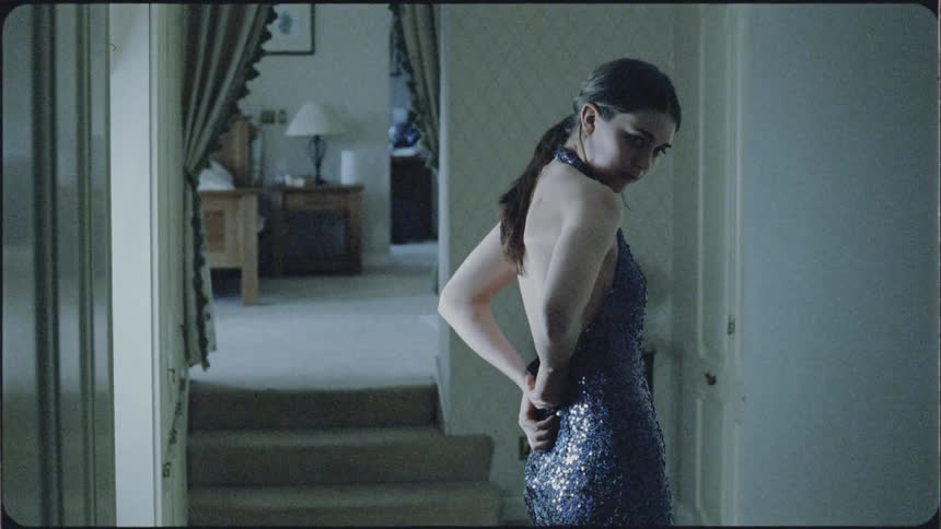 Woman adjusts the evening down that she is wearing