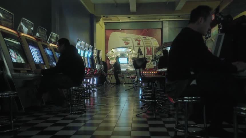 People playing slot machines