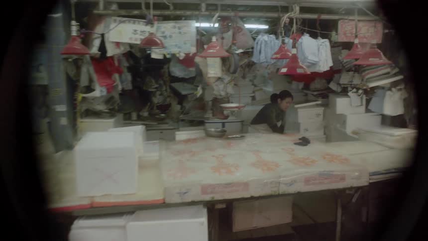 People working and shopping in a chinese grocery store