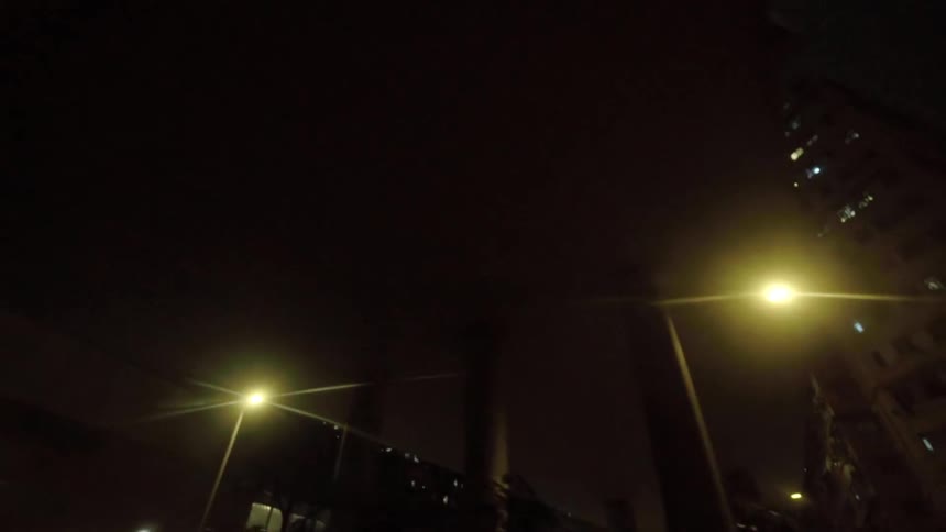 Lights are shining in buildings and skyscrapers in a city at night
