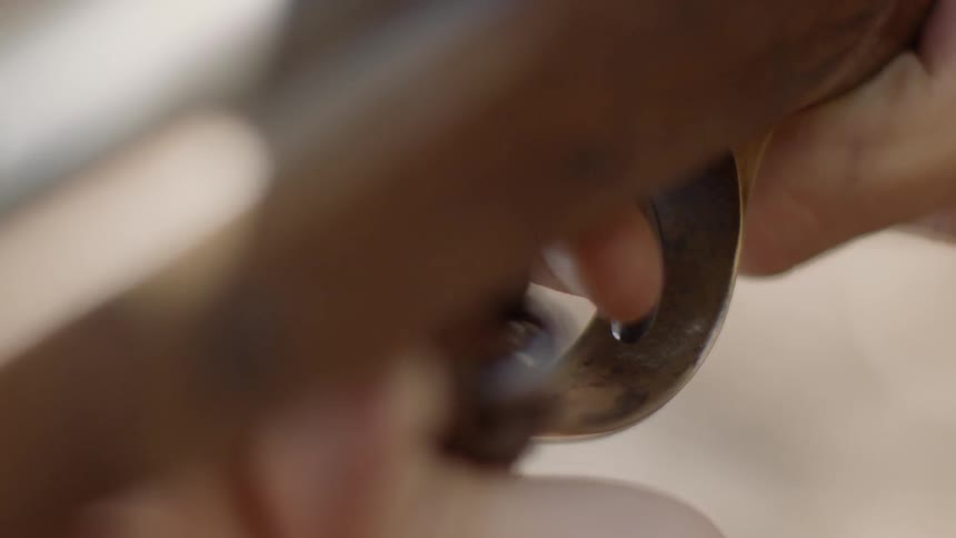 Persons finger pulls a trigger on a rifle