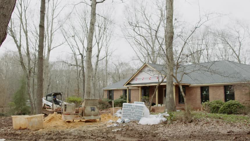 Construction work is done on a house