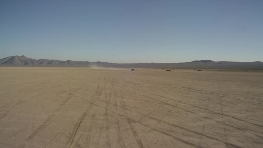 A car driving in the desert