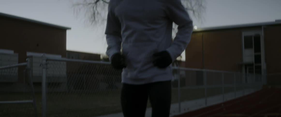 An athlete warms up on an outdoor race track