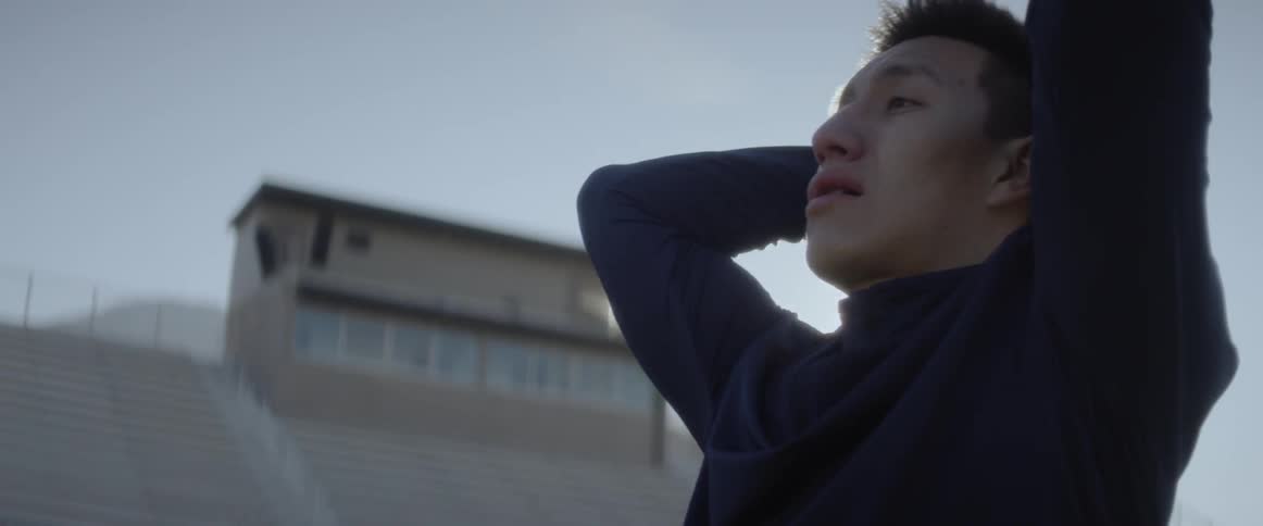 Exercising man stops to catch his breath