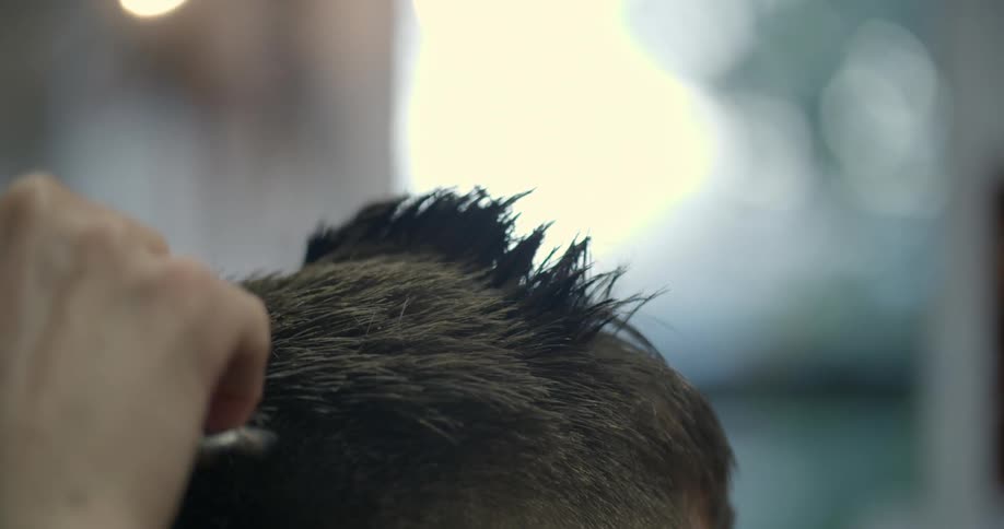 A man is cutting hair