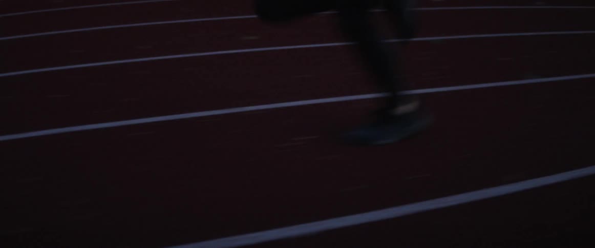 A person runs on a track