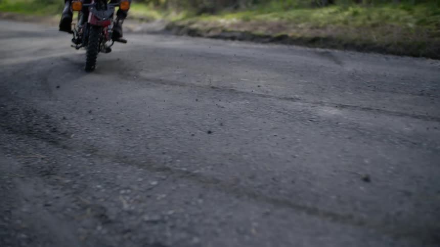A biker is riding his bike