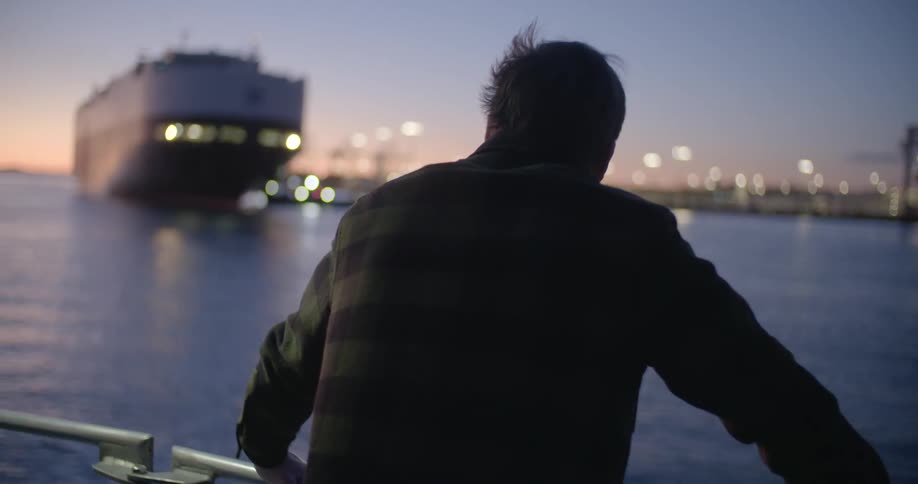 A man is riding on a boat