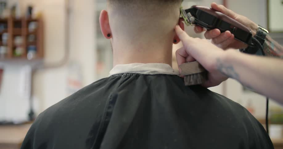 A man is getting a haircut
