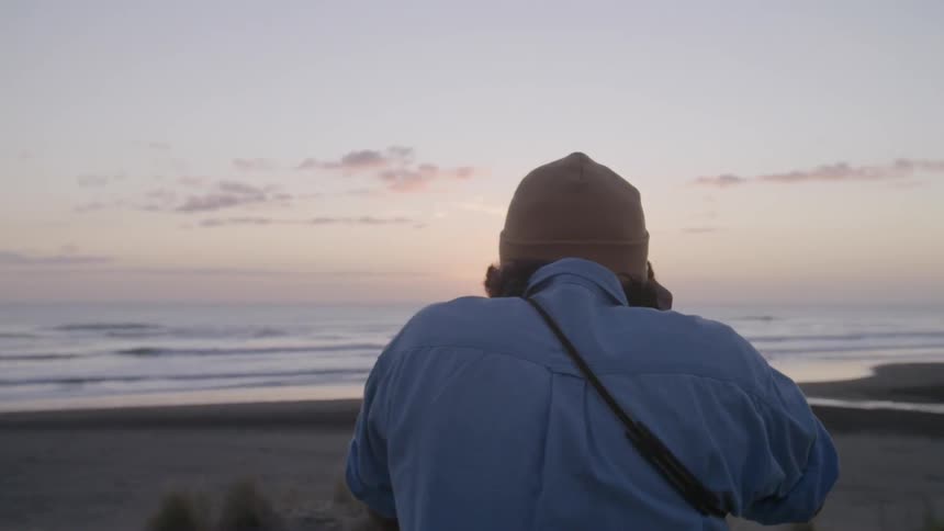A person taking pictures of nature