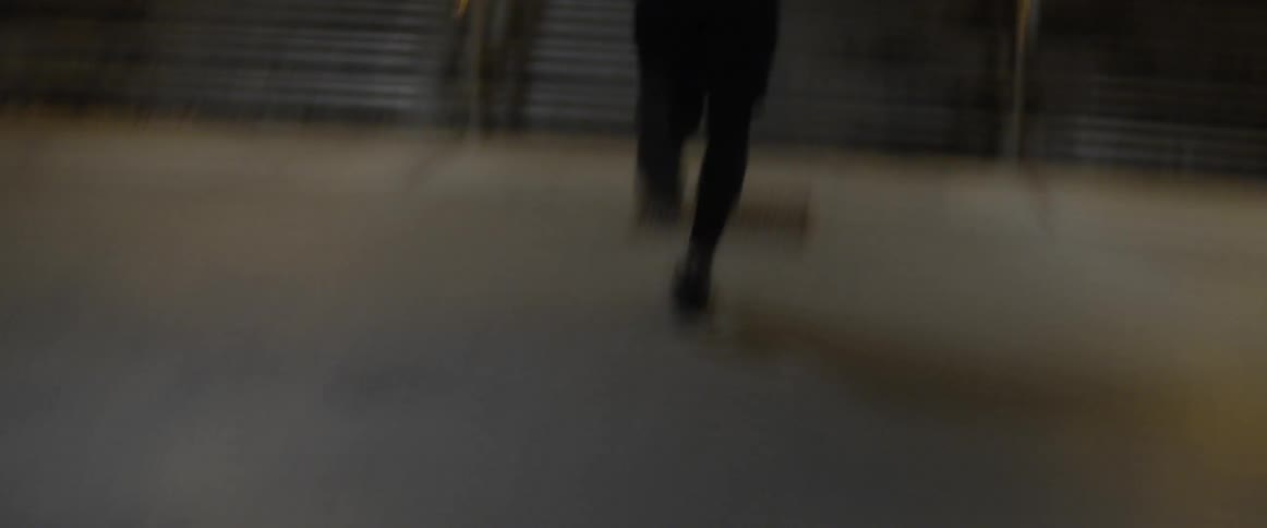 A man in workout gear runs up the steps