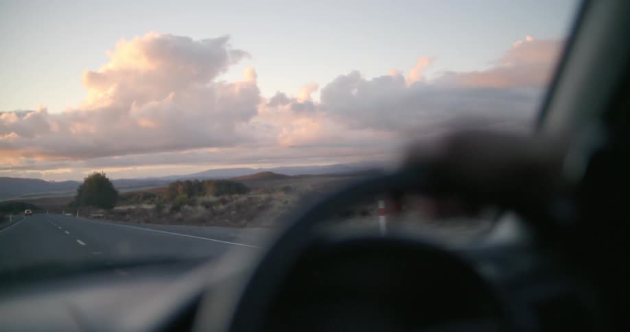 A car drives down the highway