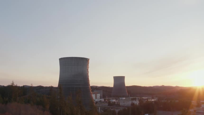Power plant cooling towers at sunset