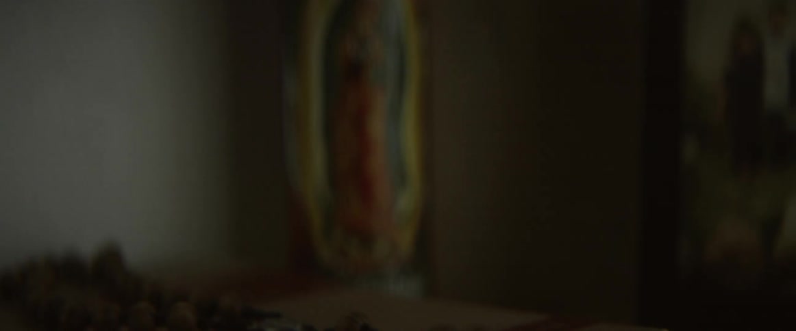 A book has rosary beads on top