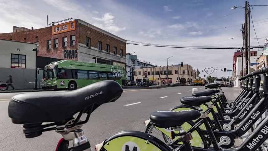 Metro bicycles are parked on a city street