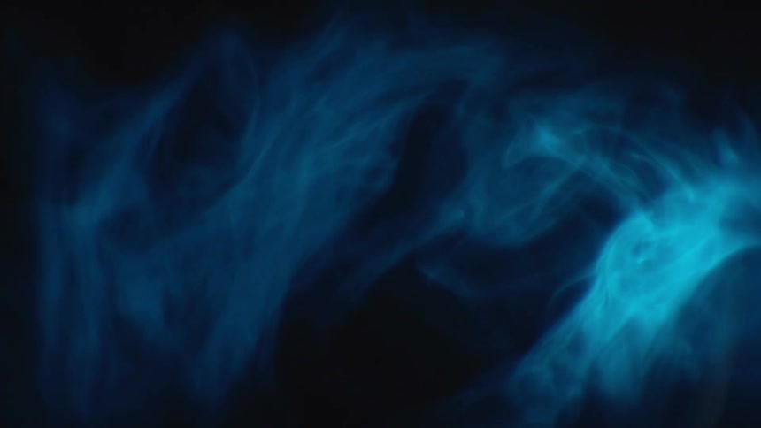 Smoke swirls around in the dark