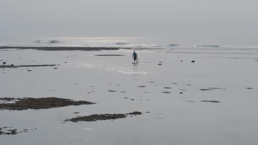 Man walks on a beach