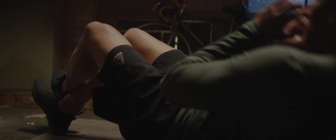 Man does sit-ups on floor