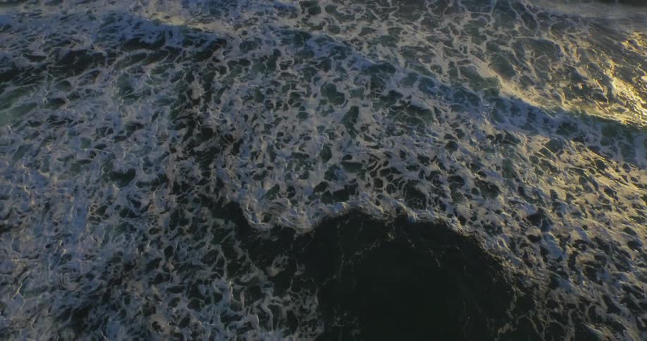 Waves are rolling into the shore