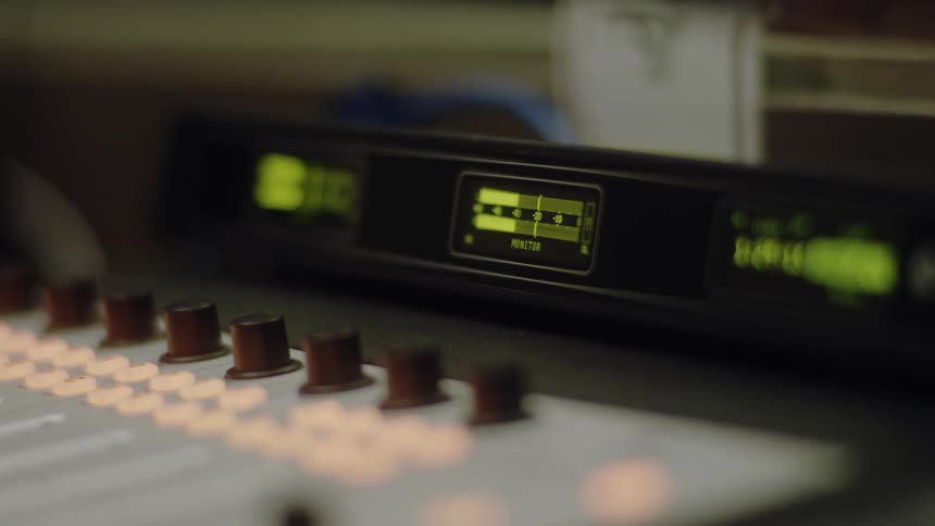 The lights flash on the mixer board