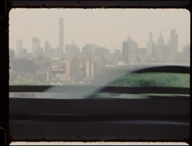 Vehicles travel on a large city bridge