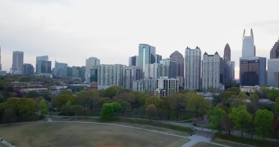 Skyscrapers stand in a city at sunrise