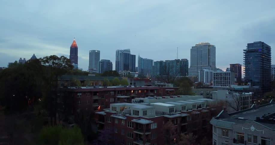 The apartment buildings lead to towers in the distance