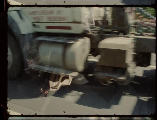 A car passes a semi truck