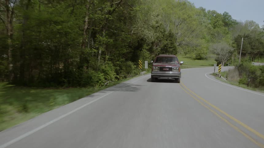The vehicle slowly travels along the road