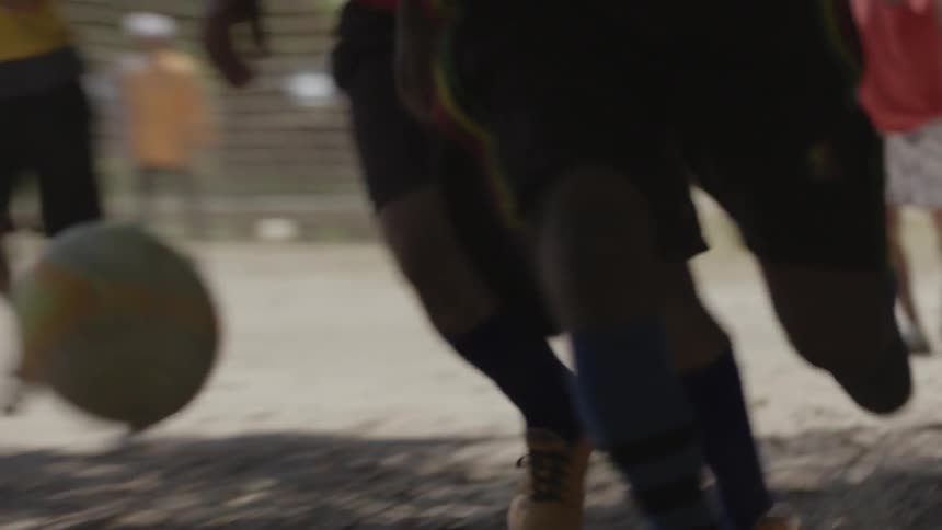 People are playing soccer in the park